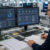 Electronics procurement engineer reviewing a digital quotation platform with supplier pricing, stock availability and quotation workflow dashboards within a UK electronics manufacturing facility.